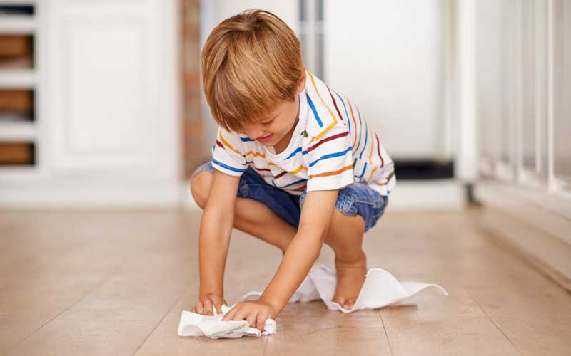 cleaning up floor with paper towels