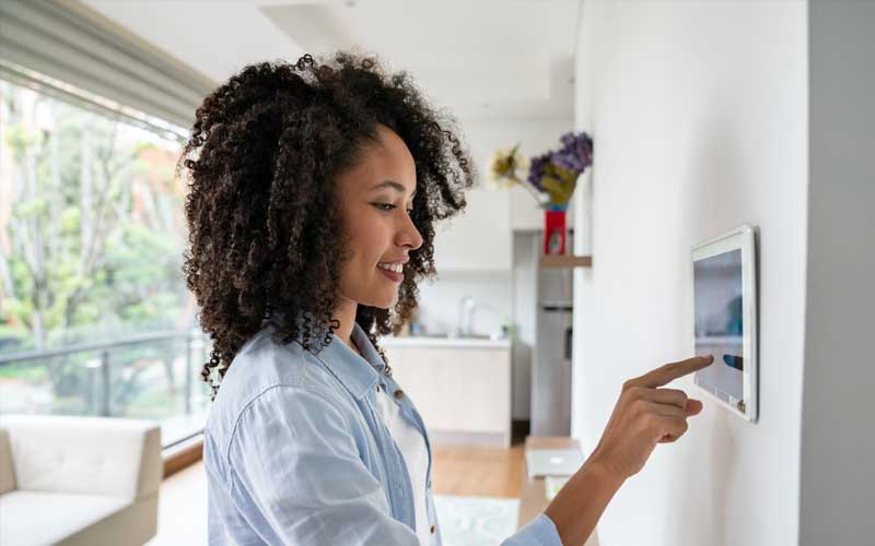 woman using automated home features