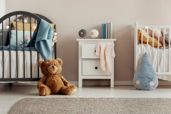 Brown teddy bear on baby bedroom