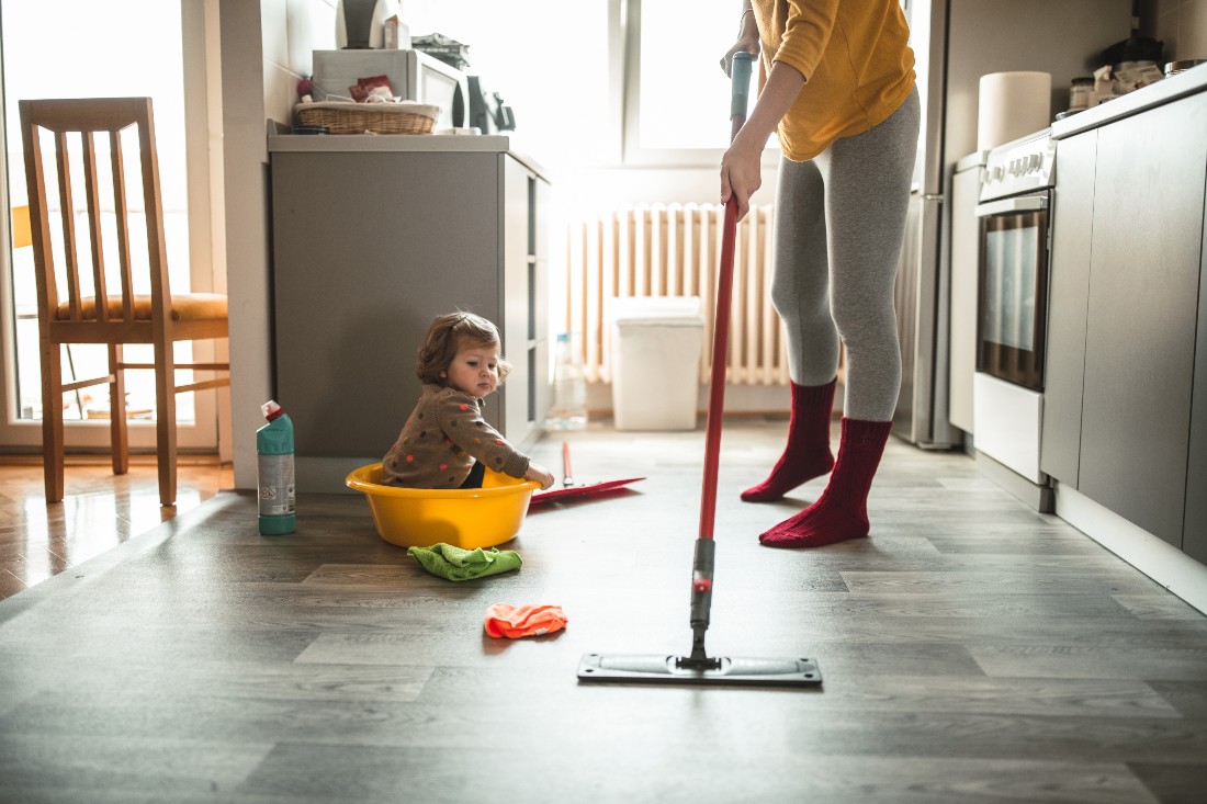 https://blog.irobot.com/wp-content/uploads/2022/10/mother-with-a-baby-girl-doing-housework.jpg